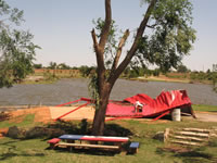 Damage associated with the tornado in the Fair Park area (east of the High School).