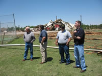 LaMarre, NWS Lubbock Warning Coordination Meteorologist, reviews damage survey information with local officials following a tornado impact in Childress, TX on May 10, 2006. 