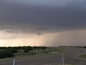 Sequence of images of a severe thunderstorm that tracked across northern Briscoe and Hall Counties on 8 June 2008. The images was taken from Highway 86, about 5 miles northwest of Quiteque, looking north. The pictures were taken, from left to right, around 8:22 pm, 8:23 pm, 8:26 pm, and 8:53 pm, respectively. Click on the images for larger views. Pictures courtesy of David Purkiss. 