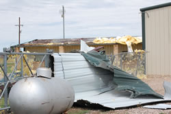 Roof damage produce just north of Abernathy on the evening of 14 August 2008. Photos by Jody James. Click in the image for a larger view.