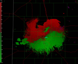 Radar velocity images taken from the Lubbock WSR-88D radar around 7:06 pm CDT on March 19, 2011. The image is taken from the lowest scan angle, which is around 1,000 ft above the ground. The green (red) represents air flowing toward (away from) the radar. Click on the radar image for a larger view.