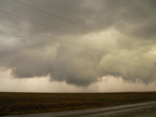 A couple of different views of a wall cloud produced by a storm in east-central Hale County just after 7 pm on 12 October 2012. The left image is courtesy of Gary Skwira and the right image is from Patrick Doll. Click on the pictures for a larger view.