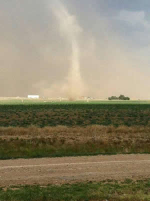 Picture of a landspout tornado outside of Lorenzo (courtesy of Tiffany Arguello). Click on the image for a larger view. 