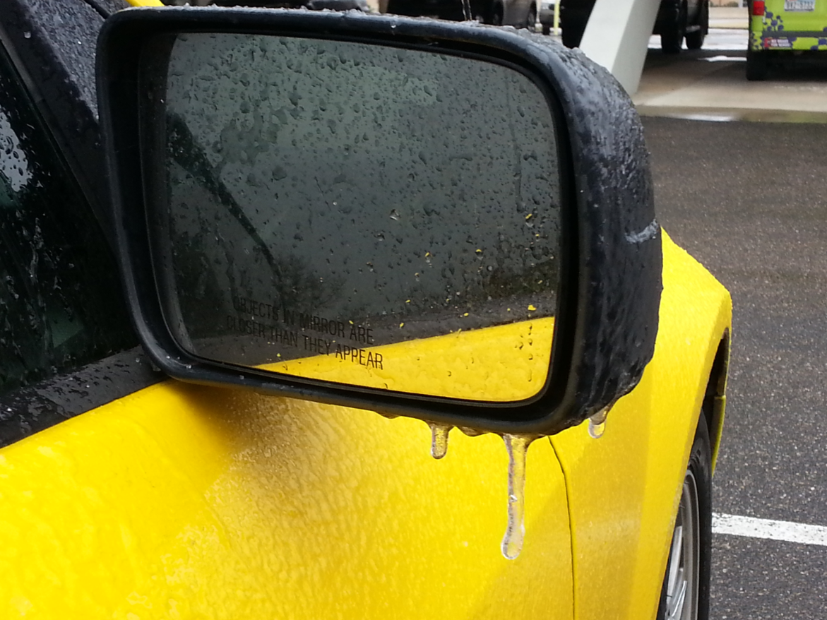 Ice accumulates on a car in South Lubbock around noon on March 4, 2015.