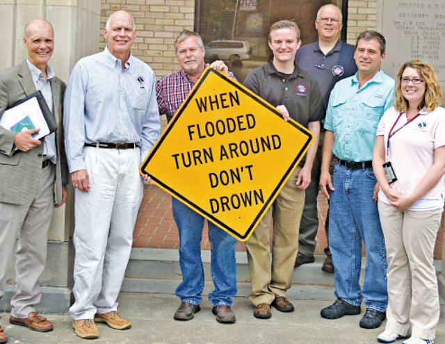 Some of the participants at the Turn Around, Don’t DrownTM dedication at Pocahontas (Randolph County) on 06/22/2017 included (from left) Jim Belles, Meteorologist in Charge at the National Weather Service in Memphis, TN, Steve Drillette, Meterolologist in Charge at the National Weather Service in Little Rock, AR (WFO LZK), Randolph County Judge David Jansen, Warning Coordination Meteorologist Dennis Cavanaugh from WFO LZK, Northeast Arkansas Coordinator Anthony Coy, Randolph County Emergency Manager Bo Graham, and Senior Service Hydrologist Tabitha Clarke from WFO LZK. The photo is courtesy of the Pocahontas Star Herald.Â