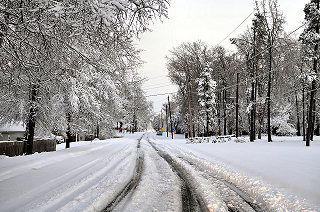 There were ruts in a few neighborhood roads in Sherwood (Pulaski County) to start the morning on 12/26/2012. Otherwise, most roads were snow covered and hazardous.