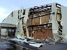 A church building and gym were heavily damaged 2.6 miles east-northeast of town.