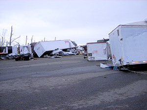 Along the highway, trucks were tossed like toys.