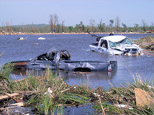 At a mobile home park to the southwest of Vilonia (Faulkner County), pickup trucks were thrown into an adjacent lake.