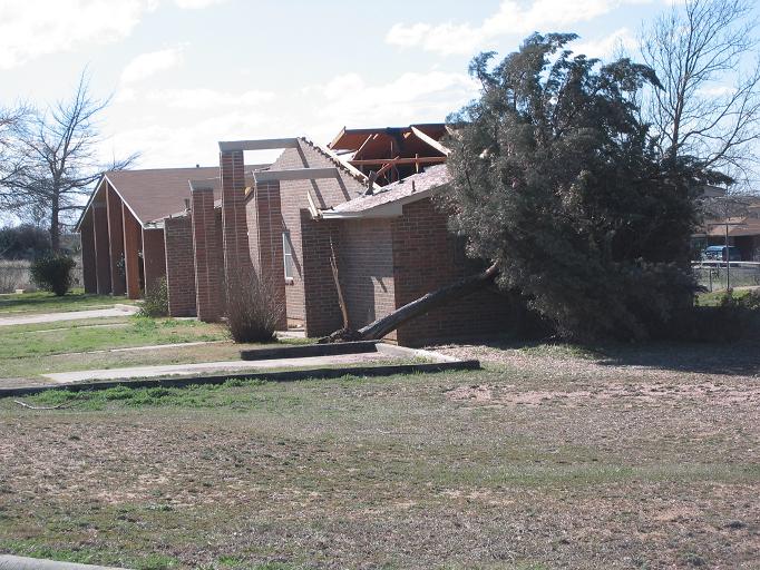 photo of a roof partially removed from a residence