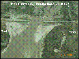 Aerial photograph of flooding through Dark Canyon Draw
