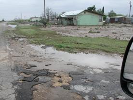 Flood damage near a home in Toyah