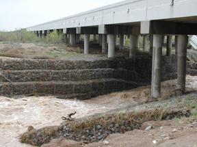 Water flowing under the Interstate 20 bridge near Toyah