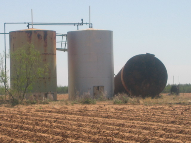 Storm damage showing a radio tower bent down to the ground