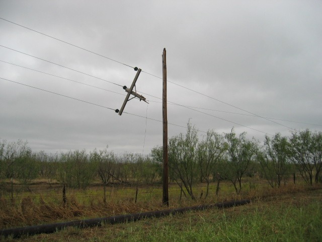 Photo of power pole damage along State Highway 137.