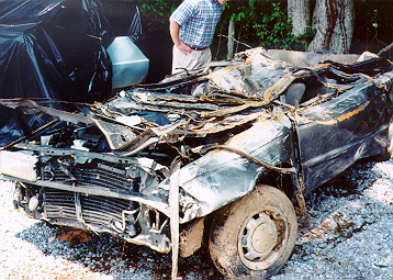 Another view of damaged car.