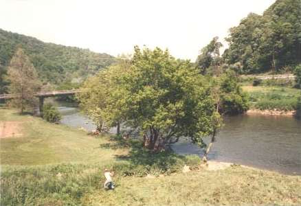 Image looking upstream at Highway 82 bridge from water plant