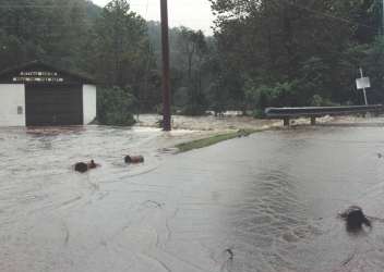 View looking upstream in front of school.