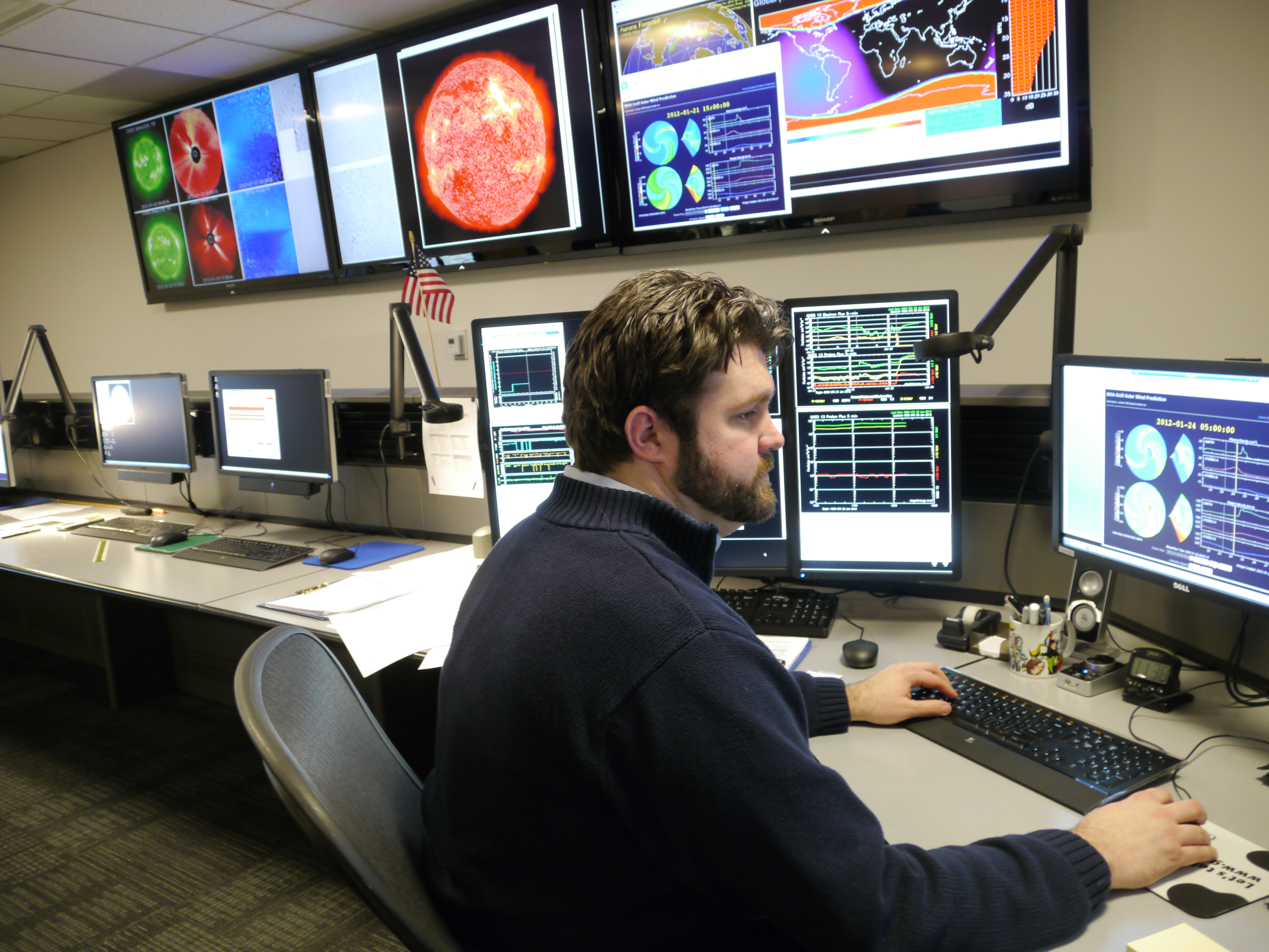 Forecaster monitors space weather at NOAA’s Space Weather Prediction Center