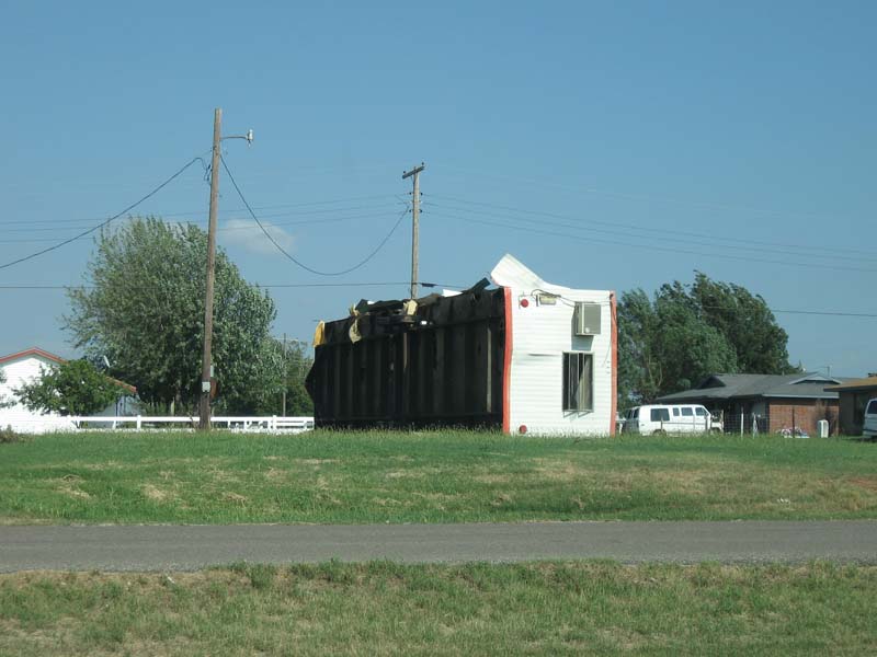 Flipped mobile home on the east side of town