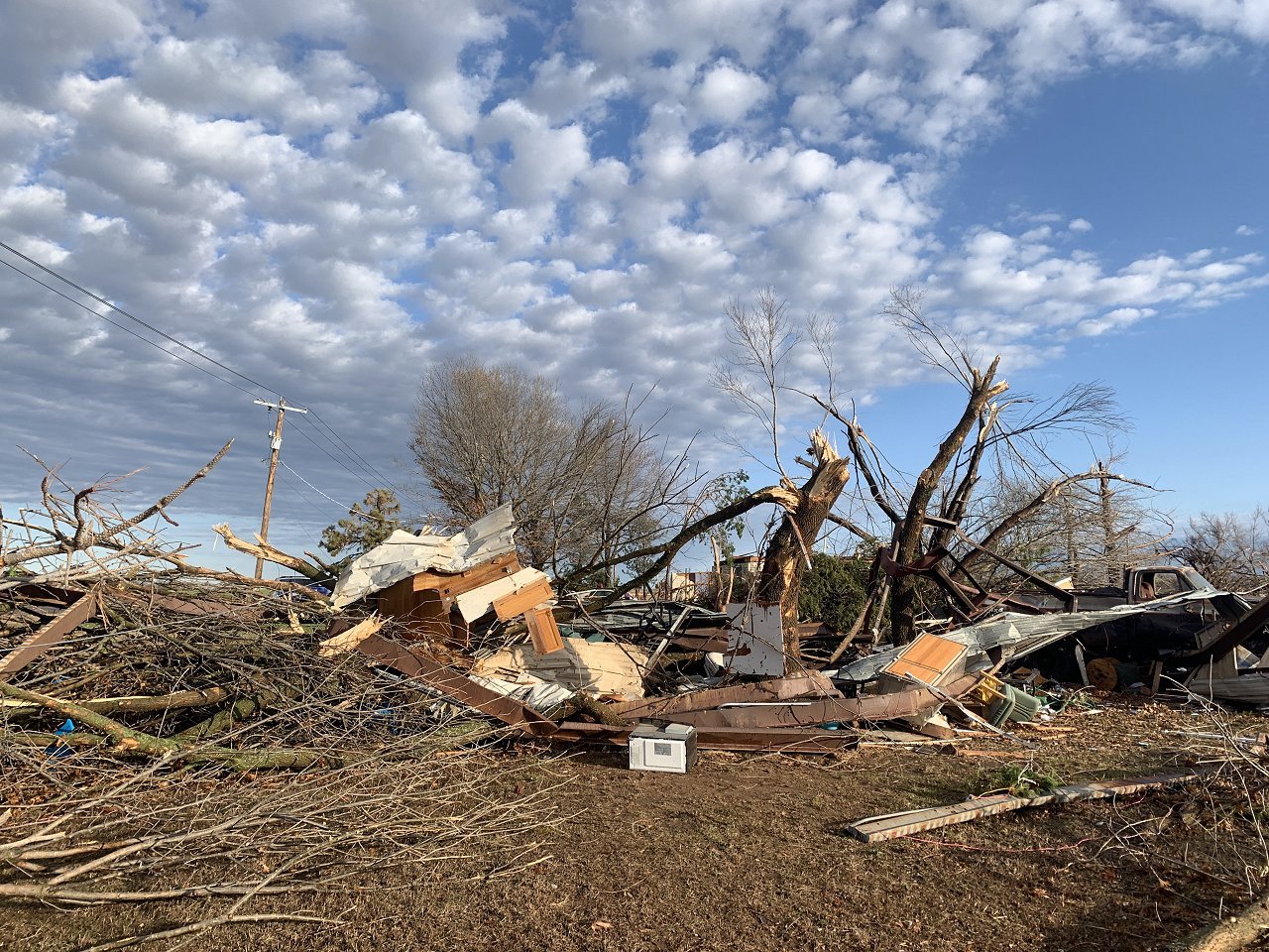 December 13, 2022 - Photo of a damaged home and a workshop about 1 mile north-northeast of Wayne, OK along Nicholas Drive