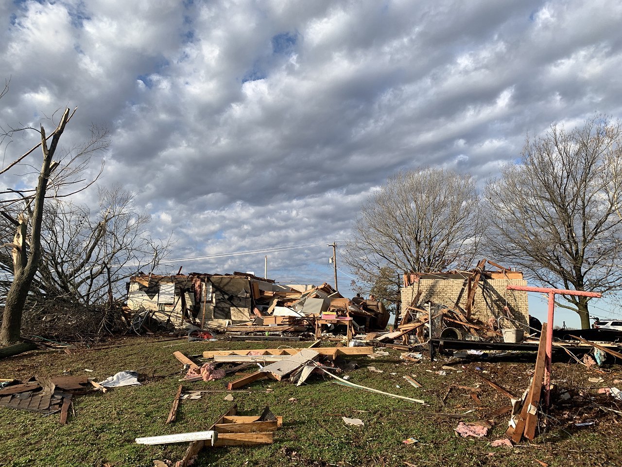 December 13, 2022 - Photo of a damaged home and a workshop about 1 mile north-northeast of Wayne, OK along Nicholas Drive