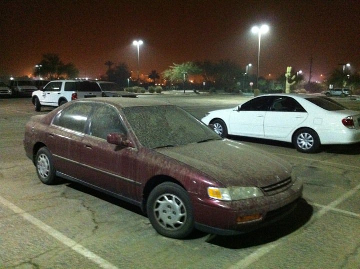 A dusty NWS employee car. Note that the air remains hazy, nearly three hours after the dust storm moved through.
