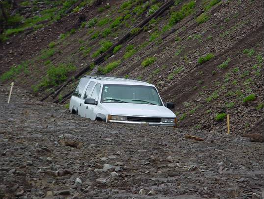 Vehicle trapped in mudslide near Sylvan Pass in Yellowstone National Park