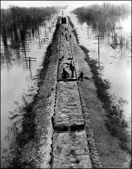 A trainload of sandbags is transported to line the Mississippi mainline levees to defend against rising waters of the Mississippi River in the flood area in Marion, Ark., Jan. 30, 1937. (AP Photo)