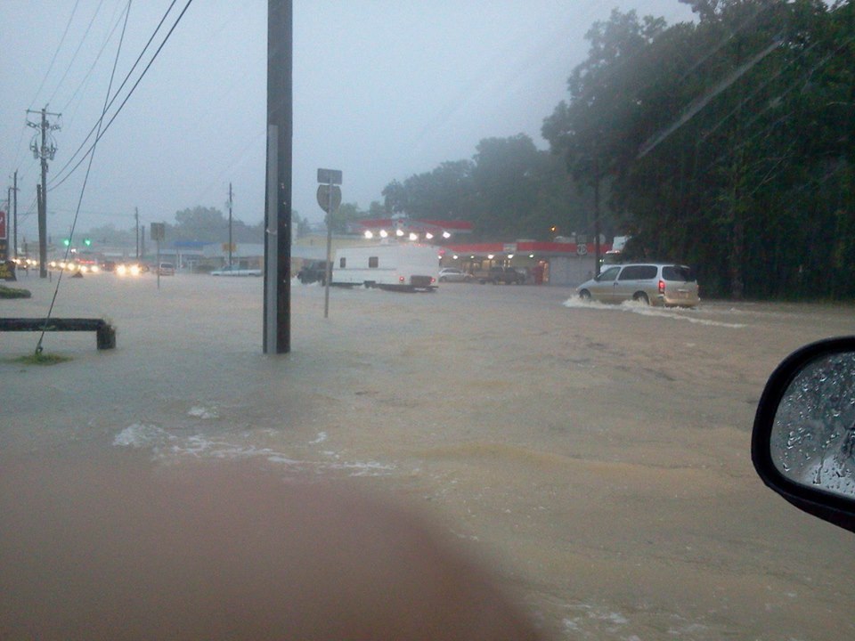 Flood waters inundate a major roadway in Bonifay, FL on July 3, 2013.