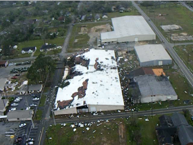 Aerial view of significant damage to the roof of a warehouse in Fitzgerald, GA, caused by an EF-1 tornado that struck on April 13, 2009.