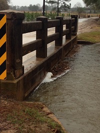 Flood waters reach the base of a bridge on Old Brookfield Roadt in Tifton, GA on December 24, 2014. Photo submitted by Vickie Hickman via Facebook.