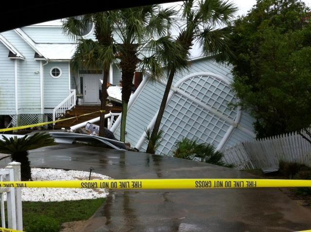 A portion of a home was undermined as the underlying dune was washed out by the excessive rainfall in Walton County, FL on April 30, 2014. Photo submitted by Walton County Sheriff's Office to WMBB-TV.