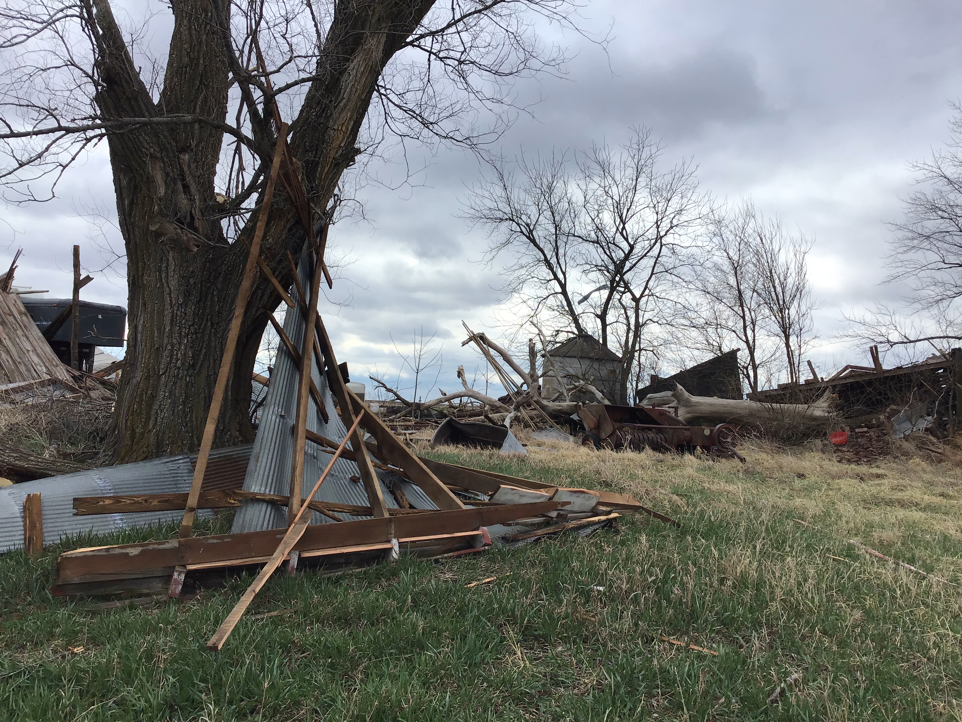 Debris scattered around a farm field.