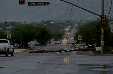 Picture of down power lines/poles in Tucson.