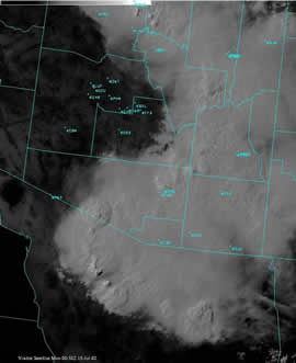 Visible satellite image from an onset phase severe thunderstorm outbreak over southeast Arizona, July 14, 2002.