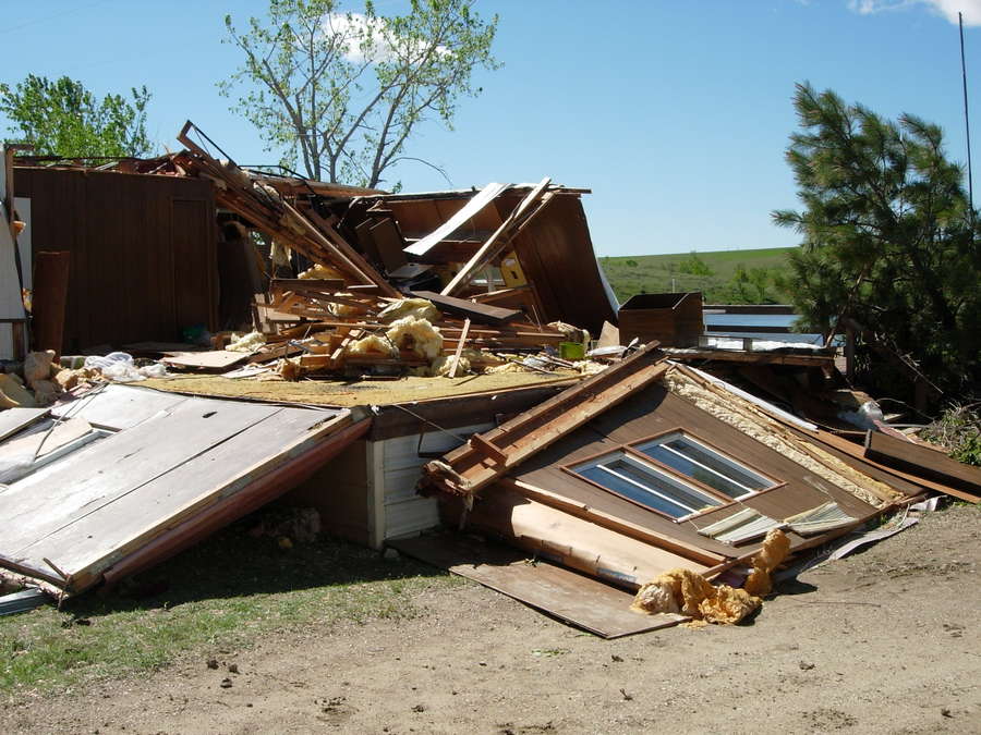 Damage to manufactured home southwest of Howes (NWS storm survey photo)