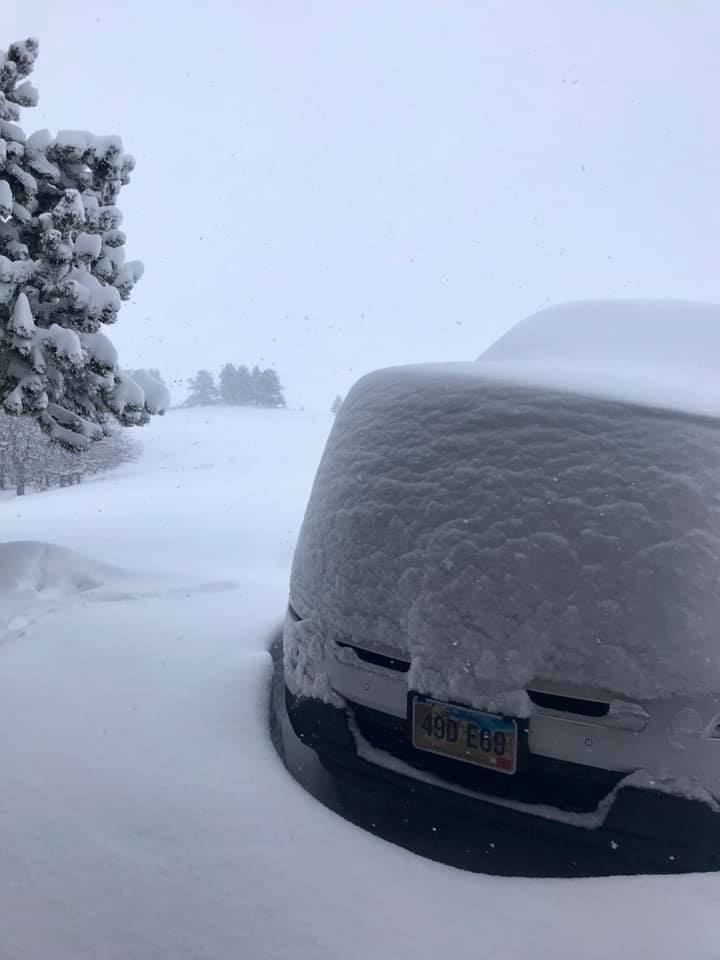 Deep snow piled on a car near Whitewood, South Dakota.
