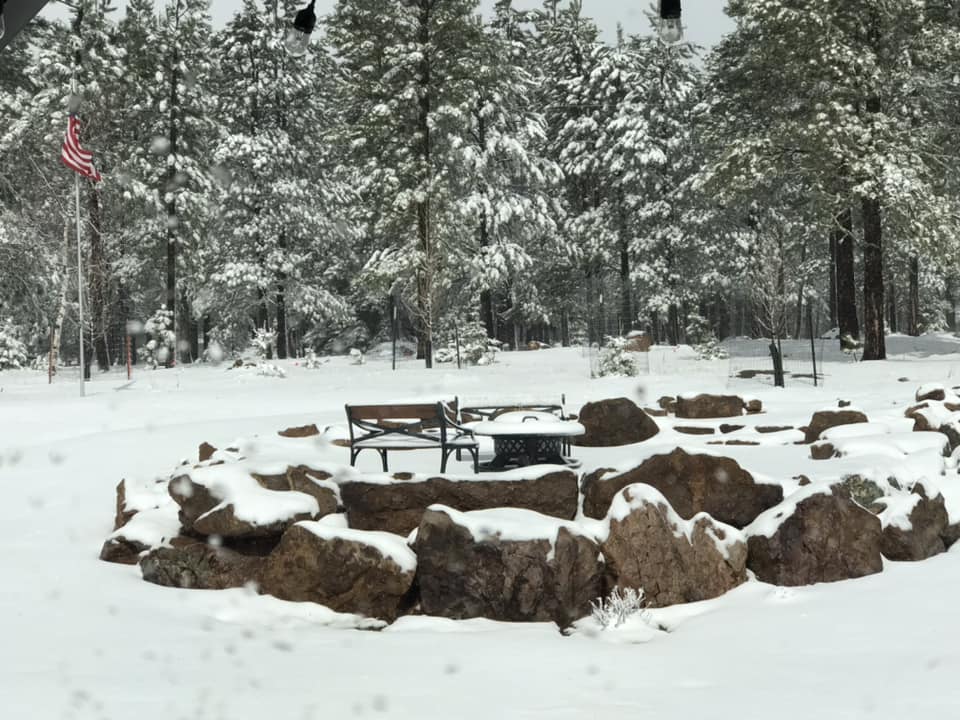 Snow-covered rock fire pit