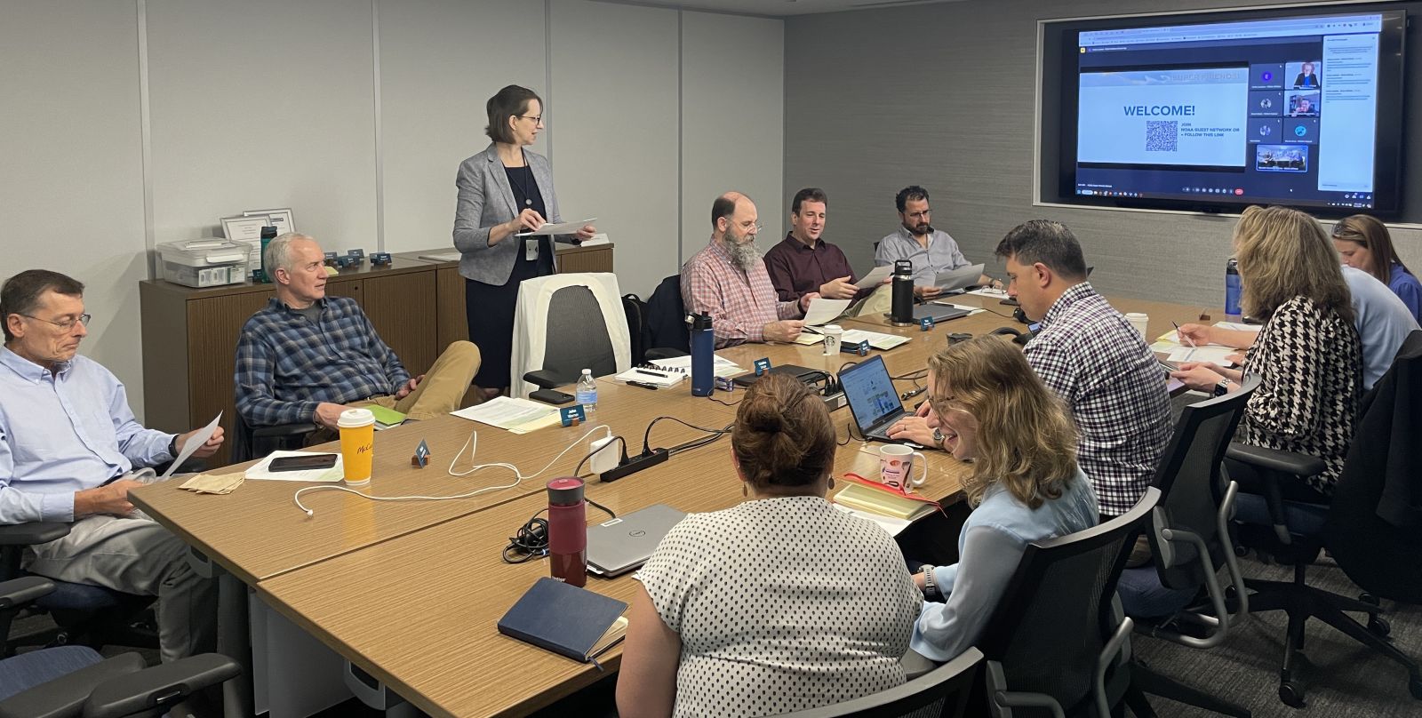 Image description: A Coastal Coupling Community of Practice working session. In the back, from left to right: Rick Luettich, John Warner, Dori Stiefel, Chris Massey, Trey Flowers, Chris Paternostro. In the front, from left to right, Rebecca Atkins, Lucila Houttuijn Bloemendaal, Pat Burke, Murielle Gamache-Morris, David Welch, and Courtney Barry. Photo credit: Cristina Urizar.