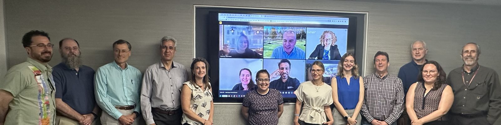 Image description: Coastal Coupling Community of Practice Super Friends. From left to right (in person): Chris Paternostro, Chris Massey, Rick Luettich, Saeed Moghimi, Courtney Barry, Cristina Urizar, Tracy Fanara, Lucila Houttuijn Bloemendaal, Trey Flowers, John Warner, Rebecca Atkins, David Welch. From top left and clockwise (virtual): Nicole Kruz, David Vallee, Emily Wallace, Hamed Moftakhari, and Emily Landeen. Photo credit: Dori Stiefel.