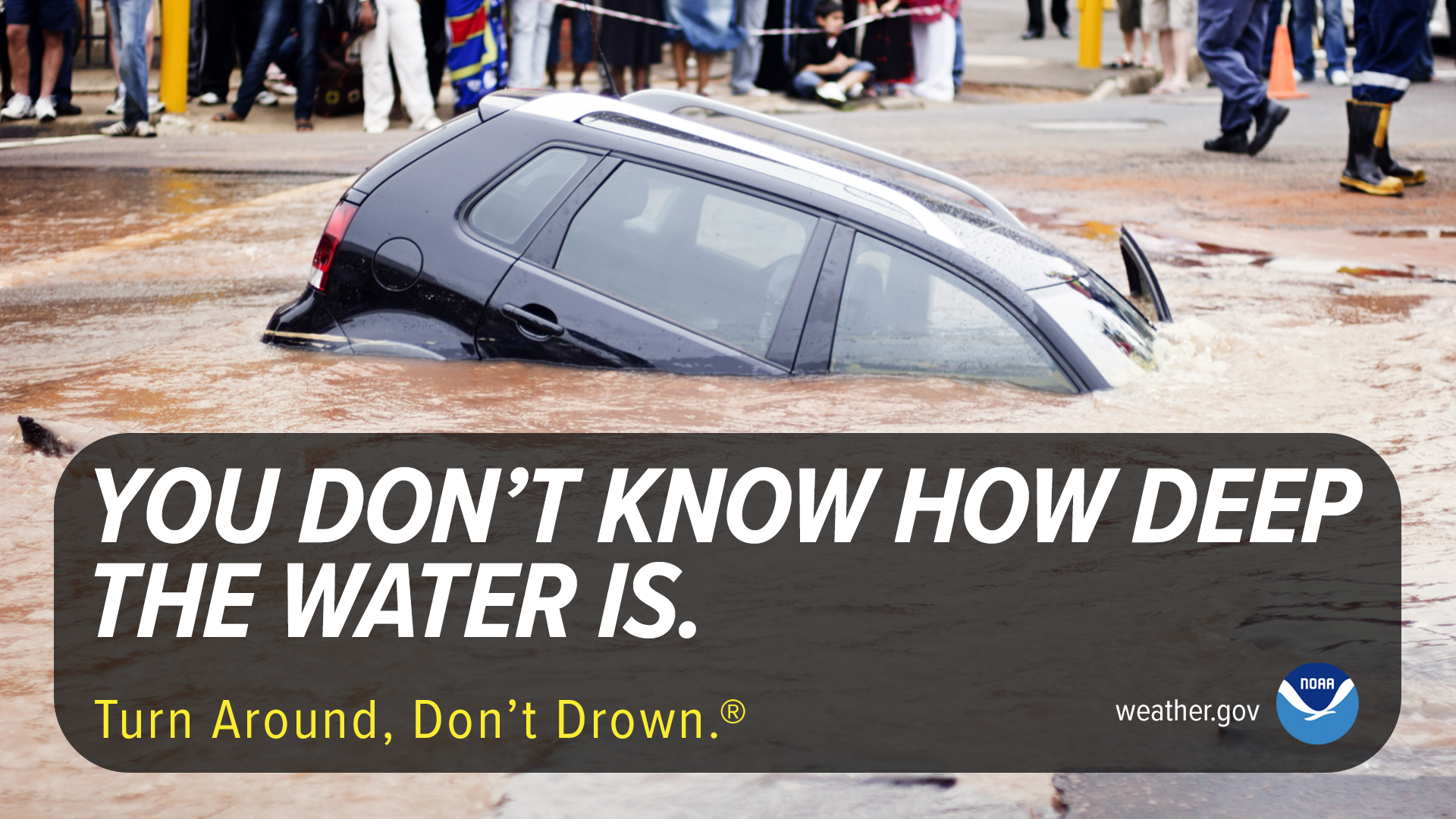 Pictured: a car submerged in water next to a sidewalk. Text: You don't know how deep the water is. Turn around, don't drown.